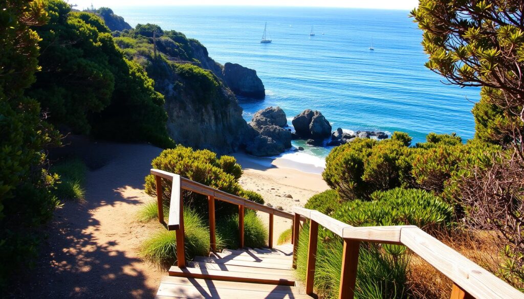 A picturesque beach access path winds through lush coastal foliage, leading to a panoramic view of the rugged Mendocino cliffs and the vast, shimmering Pacific Ocean. The path is illuminated by warm, golden afternoon sunlight, casting soft shadows and creating a serene, inviting atmosphere. In the foreground, weathered wooden steps and a sturdy handrail guide visitors down to the sandy shore below, where gentle waves lap against the rocky outcropping. In the distance, a handful of sailboats dot the horizon, adding to the tranquil, seaside ambiance. This idyllic scene captures the essence of the Mendocino coast's natural beauty and the easy access to its breathtaking beaches.